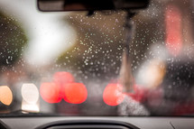 rain and bokeh lights on a car windshield 