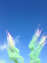smoke and sparks in a blue sky 