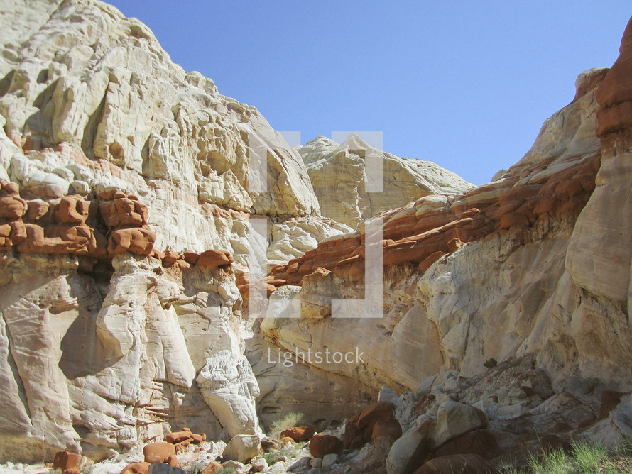white and red rock cliffs in a canyon 