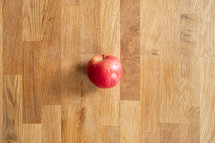 apple on a wood floor 