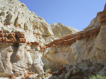 white and red rock cliffs in a canyon 