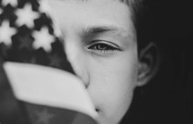 child holding an American flag 
