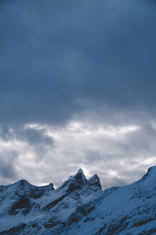 jagged mountain peaks with snow 