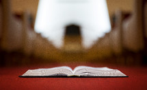 Bible in the aisle of a church 