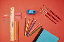 School supplies on a red background