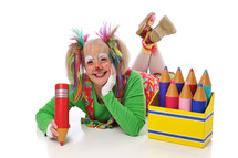 female clown holding a box of crayons 