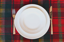 white plates with fork and knife 