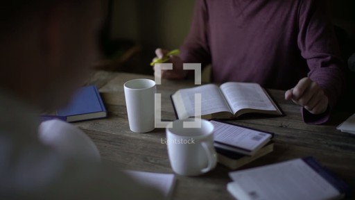 Bible study sitting around a table — Video — Lightstock