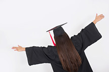 graduate with raised hands 