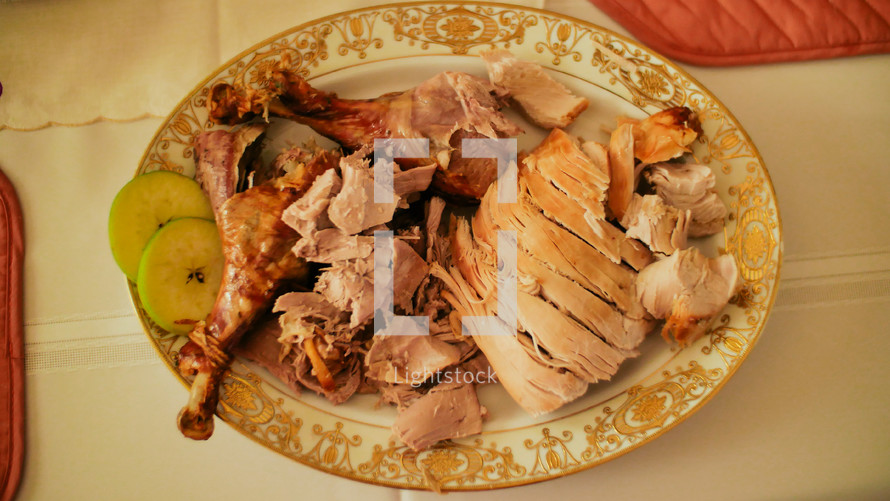 sliced turkey on a serving plate 