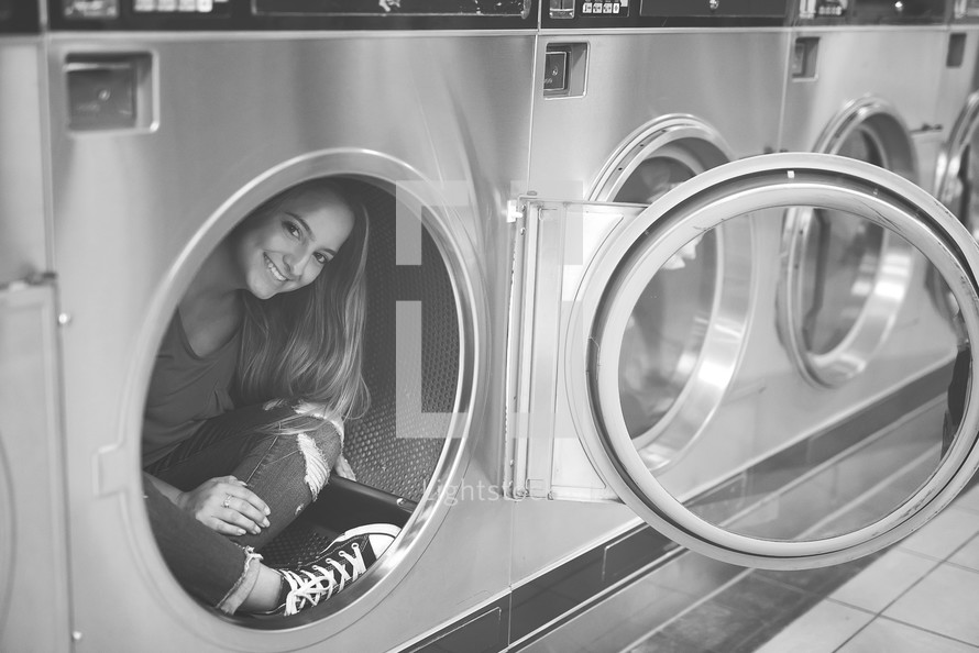 a woman at a laundry mat 