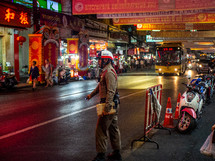 traffic cop in a city at night 