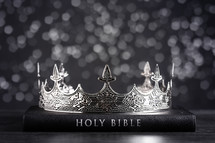 Bible and crown on a wooden background 