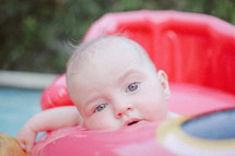 an infant in an inflatable float 