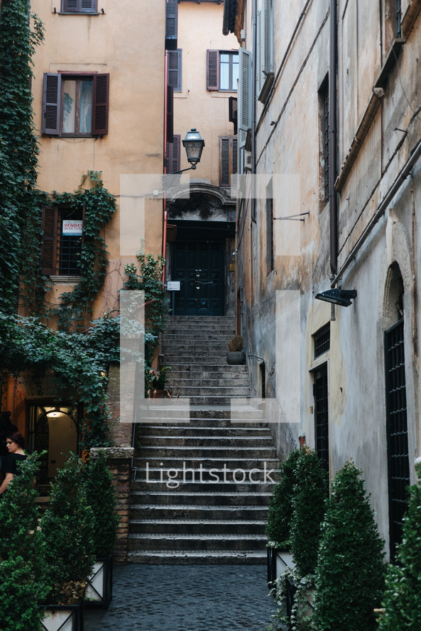steps between buildings and ivy in Rome 