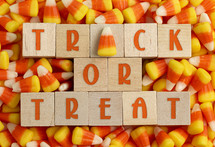 Trick or Treat Sign with Candy Corn Background