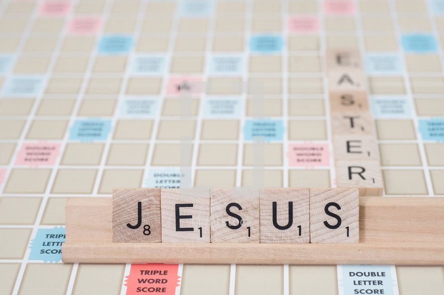 scrabble pieces forming the words Jesus and Easter