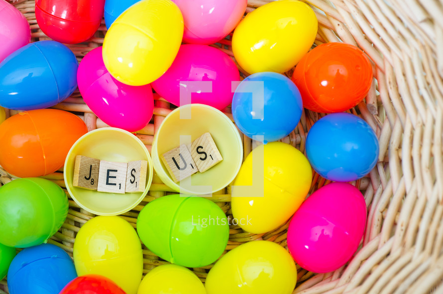 The word Jesus from scrabble pieces in an Easter Egg