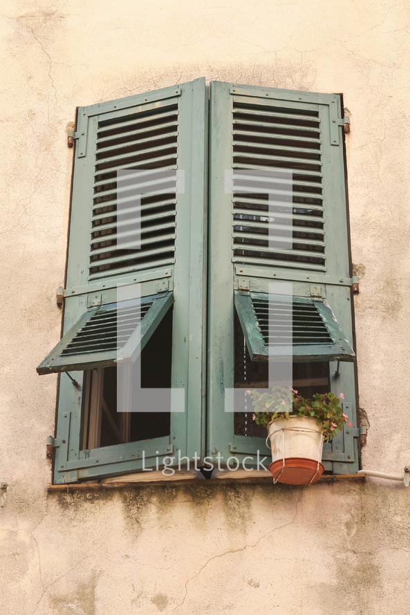 wooden shutters on a window in Italy 