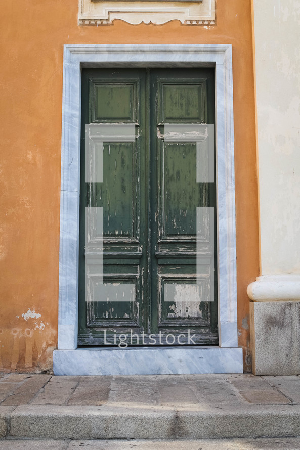 old green wooden door in Italy 