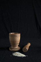 grains and wooden flour grinder