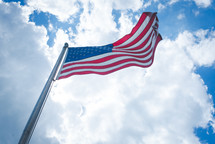 waving American flag on a flagpole 