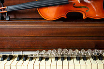 violin and flute on a piano 