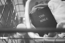 a Bible in a laundry basket 
