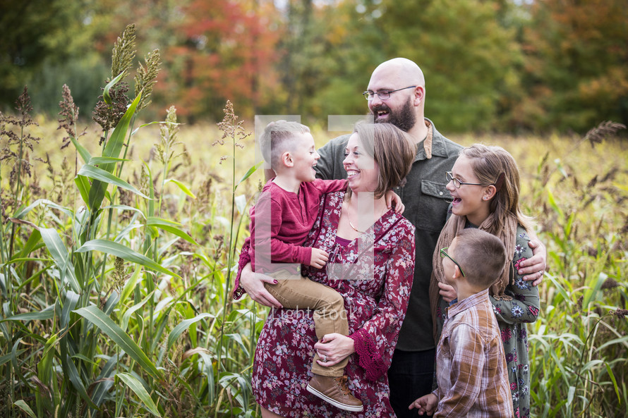 family portrait in a corn field 