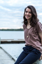 smiling teen girl on a dock 