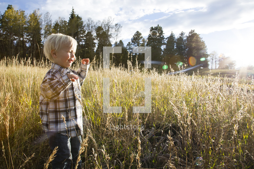 boy toddler running in a field 