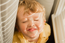 sunlight shining on a toddlers face 