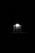 light on a shed at night 