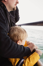 father and son on a boat 