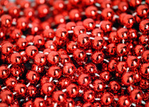 Red beaded glass garland for Christmas tree.
