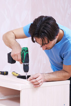 Carpenter with a drill.