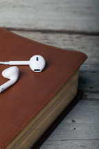 bible and ear buds