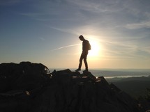 man at the top of a mountain 