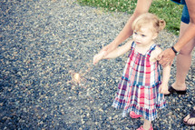 toddler and mother holding a sparkler for the 4th of July