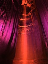 red light shining in a cavern 