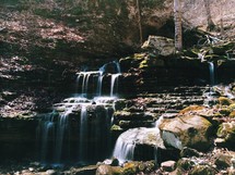A waterfall in a rocky terrain.