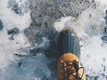 boot standing on ice 