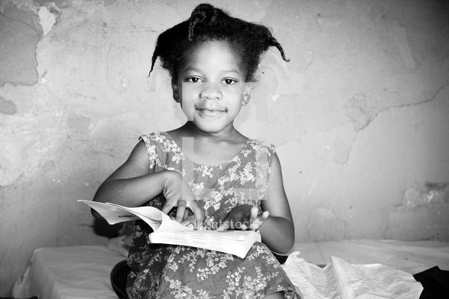 girl child reading a Bible 