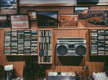 music history, cassette tapes, records, and boombox 