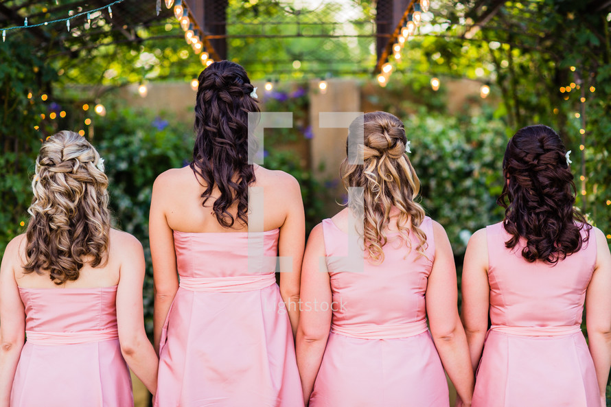 woman's hair style and pink dress bridesmaids wedding