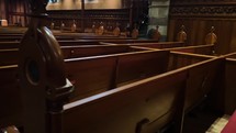 Ornate wooden pews in an old church 