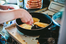 woman cooking pancakes 