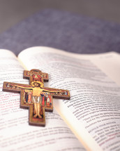 San Damiano Cross on the pages of an opened book 