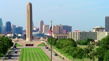 Aerial view of National WWI Museum and Memorial USA flag in front Drone shot 4K	