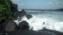 waves crashing onto a shore in Hawaii 